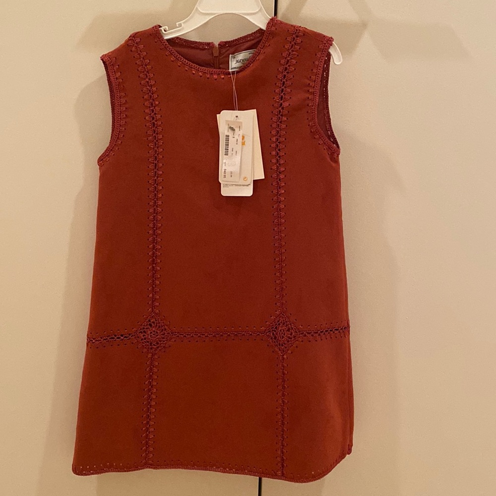 Girls size 8 faux copper rust colored suede top. Has woven knot stitch details